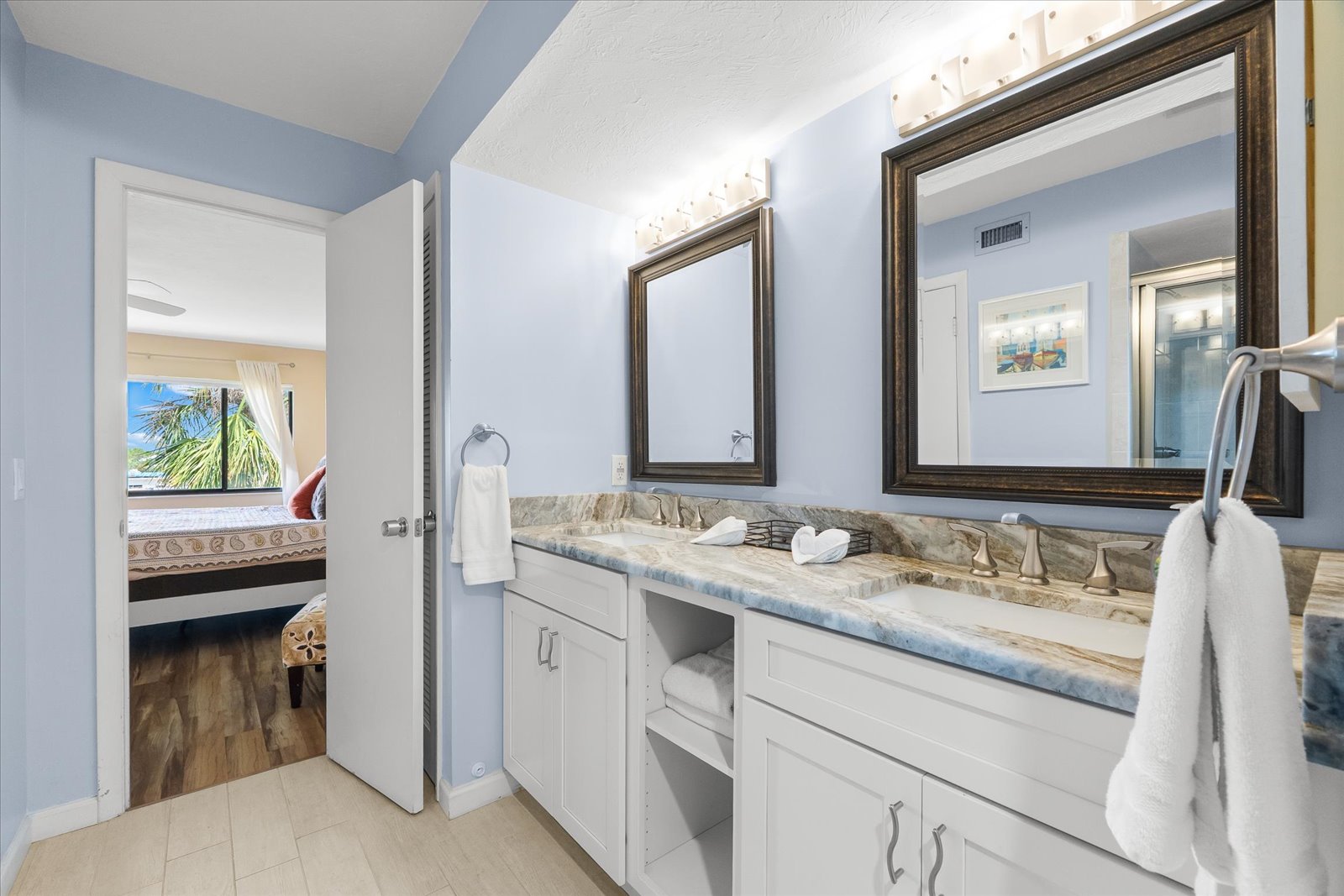 open kitchen with full appliances and granite counters in Siesta Key condo rental