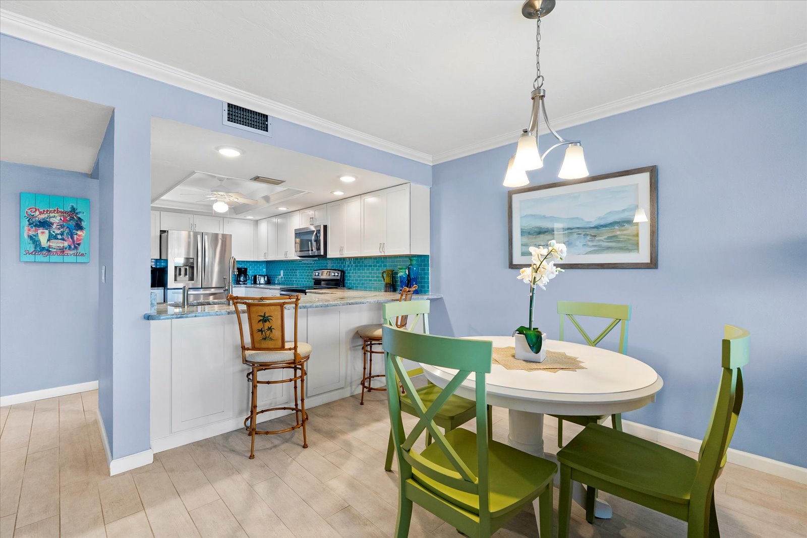 kitchen with bar seating and modern appliances inside Bayview Beauty Siesta Key