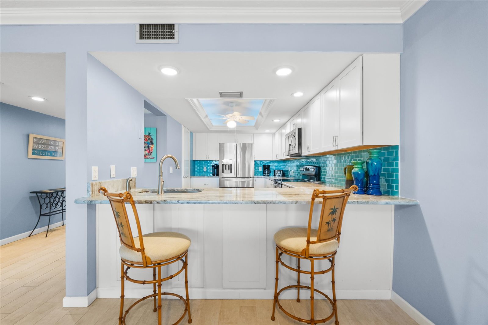 dining space with seating for four and serene bayfront views
