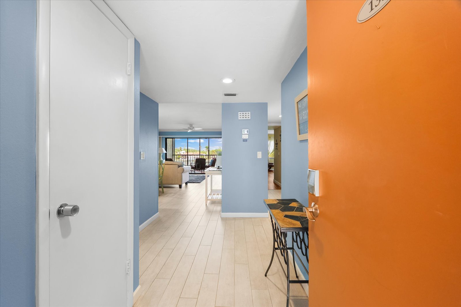 dining table for four with bright bayfront scenery inside Siesta Key condo rental