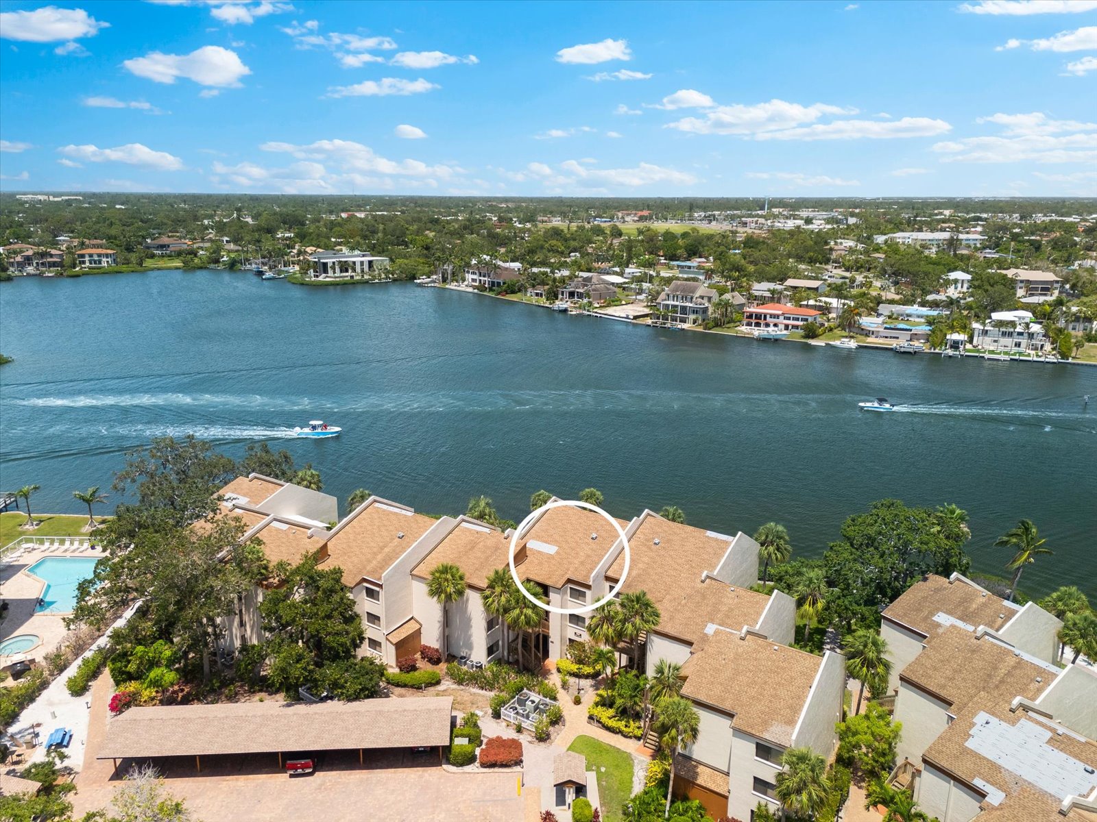 living room with coastal style smart TV and balcony access