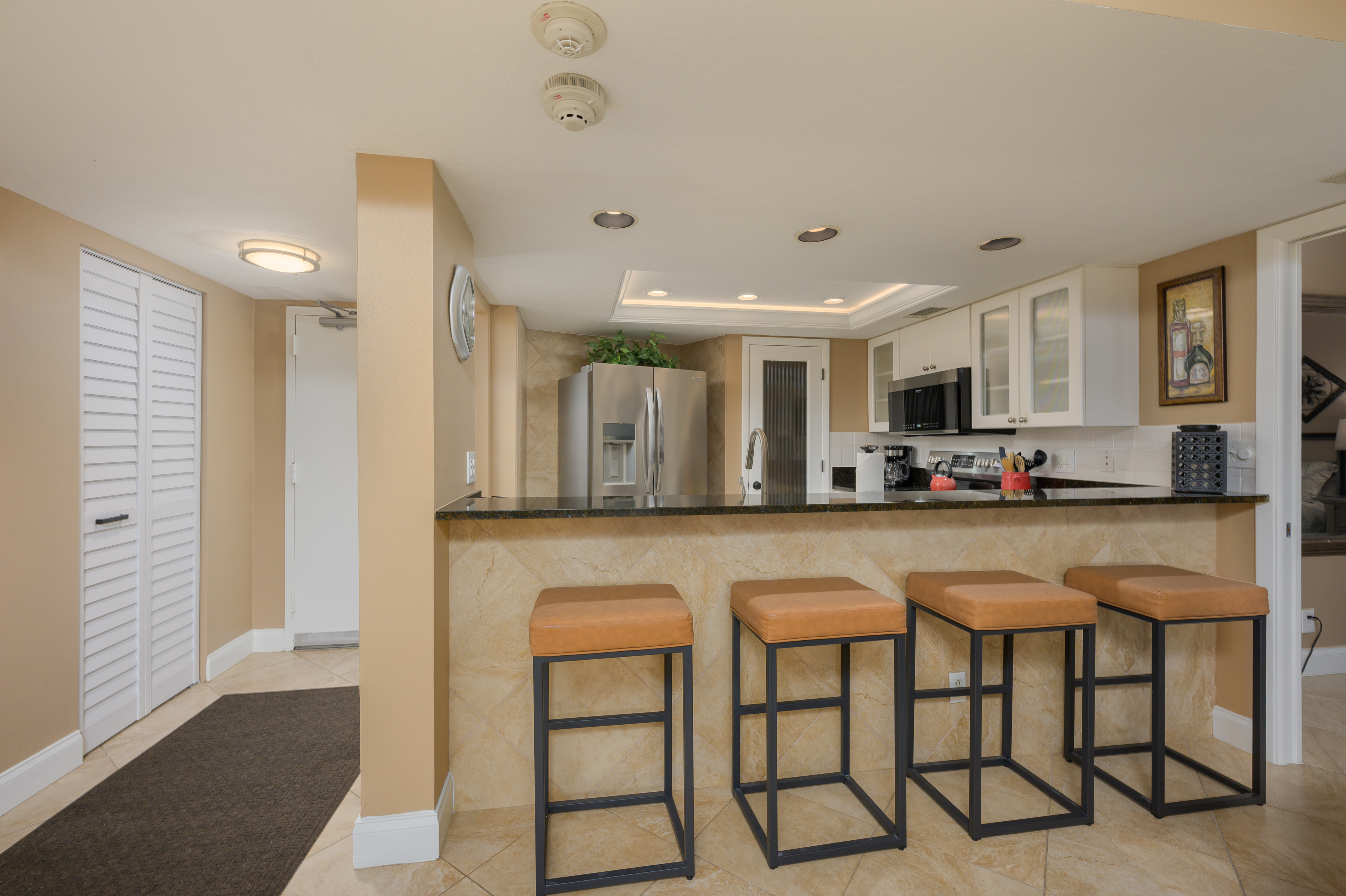 dining table and breakfast bar seating for six at Siesta Key condo