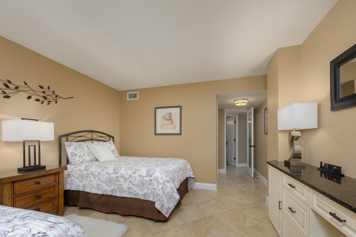 resort pool area with lounge chairs and umbrellas at Surf and Racquet Club