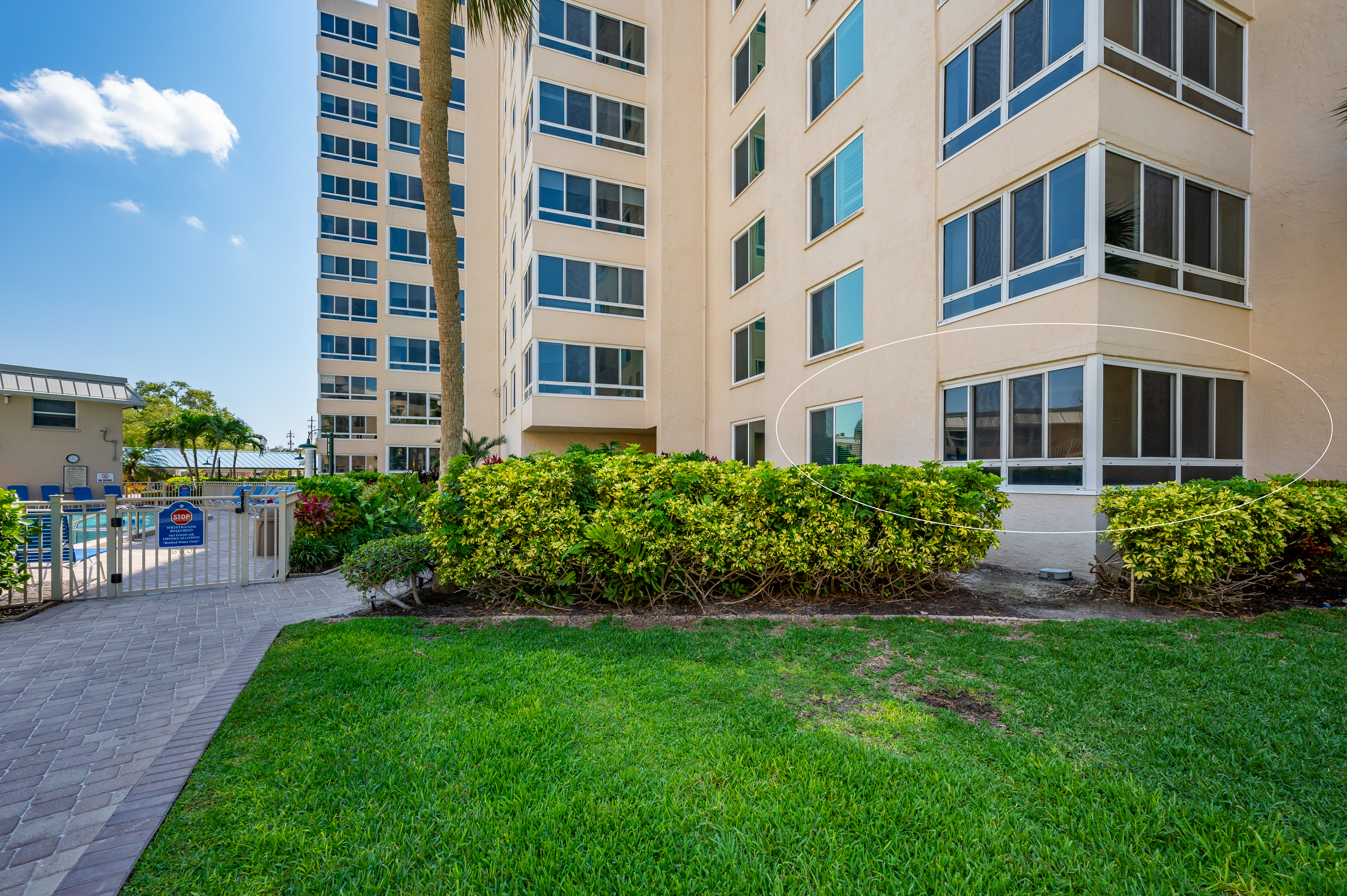kitchen with granite surfaces and stainless appliances in Tower 0104 condo